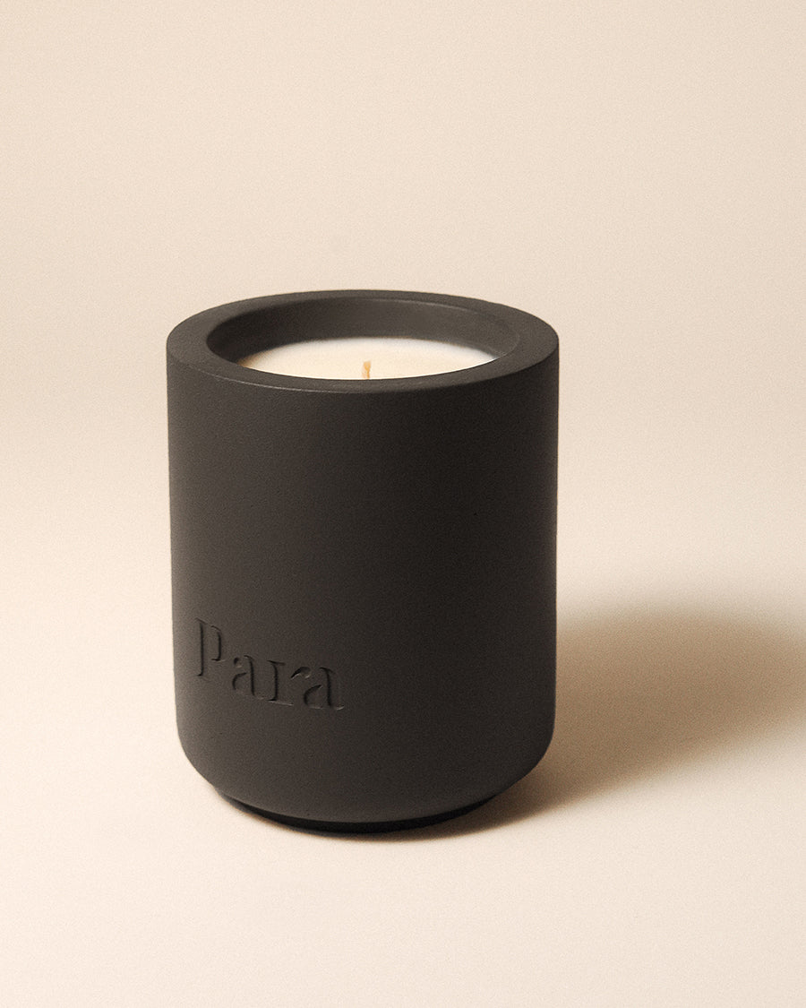 After Hours Club hand-poured palo santo and saffron candle in a black concrete vessel by Para Home Studio