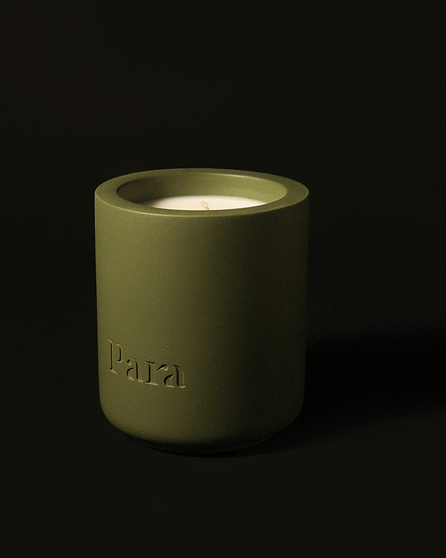 Minimalist green cement candle jar with lid featuring pine and balsam home fragrance