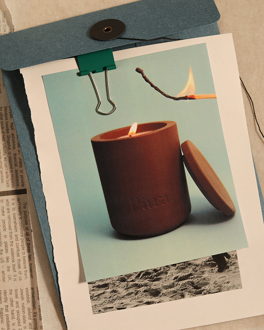 Shadowplay hand-poured sandalwood and amber candle in a brown concrete vessel by Para Home Studio