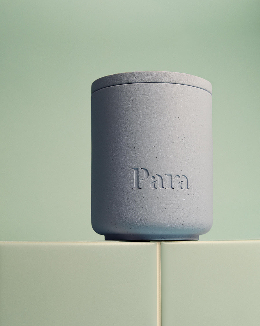 Minimalist blue cement candle jar with lid featuring luxury home fragrance