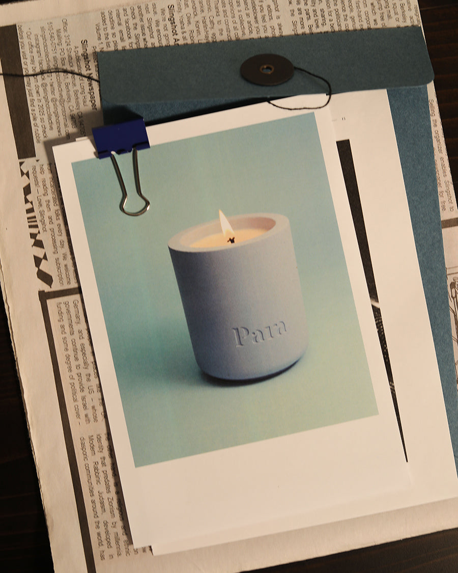 Lost on Purpose hand-poured white tea and musk candle in a blue concrete vessel by Para Home Studio