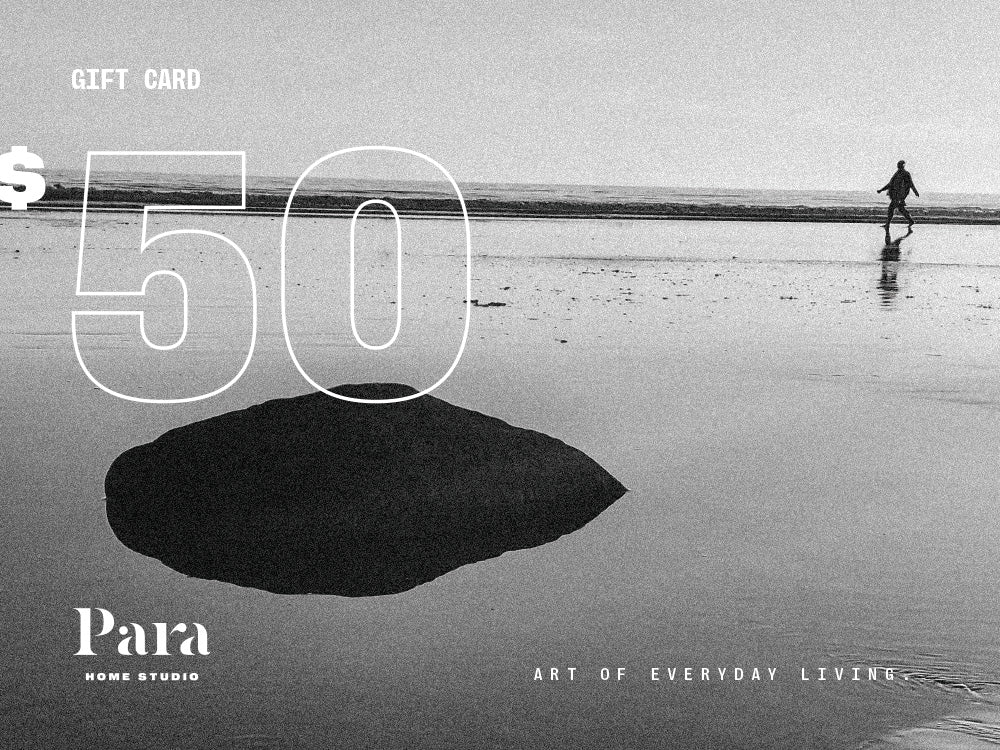 Gift card with a black and white photo of a person on a beach and 'Para Home Studio' branding. 50 dollars