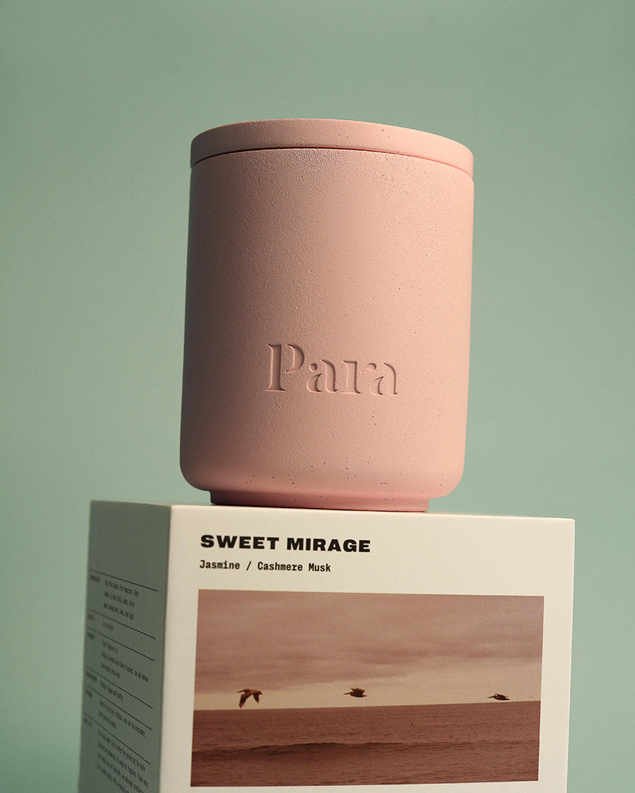 Pink concrete jar vessel candle with 'Para' branding on a light green background and packaging box
