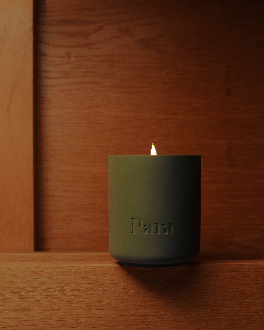 Minimalist green cement candle jar with lid featuring pine and balsam home fragrance