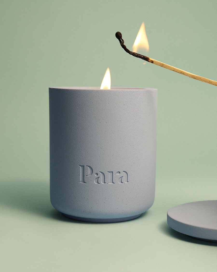 Lost on Purpose hand-poured white tea and musk candle in a blue concrete vessel by Para Home Studio