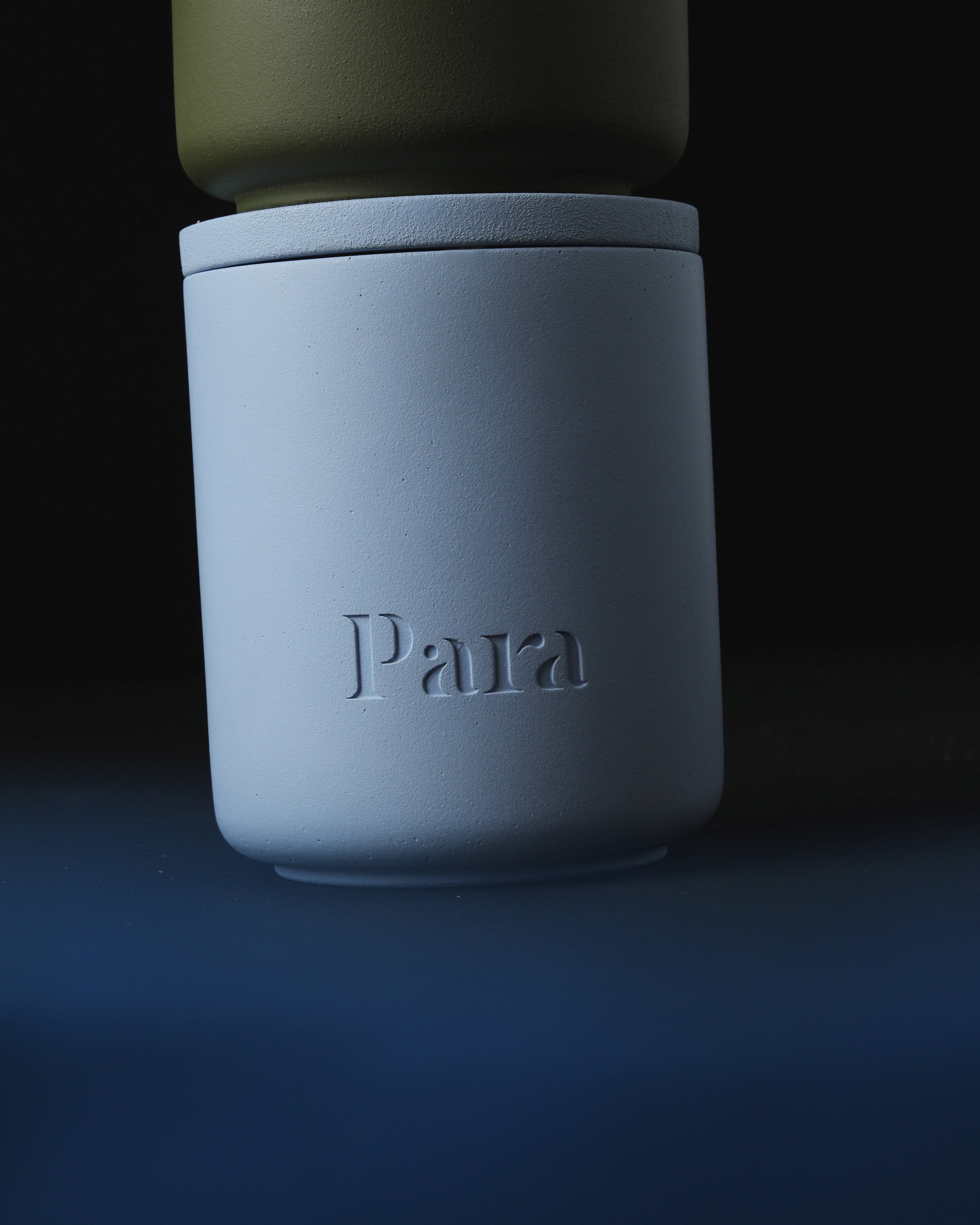 Minimalist blue cement candle jar with lid featuring luxury home fragrance